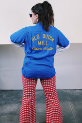 Men's or women's vintage 1960's King Louie by Holiday short sleeve bright blue button up bowling shirt with small collar, two chest pockets, and embroidery in yellow throughout.