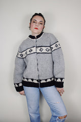 vintage 1970's long sleeve wool zip up cowichan cardigan in grey, white, and black with a deer design on the back