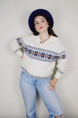 vintage 1980's Jantzen, Made in USA label long sleeve white cable knit pullover sweater with a collar, one button half closure, and an abstract print across chest