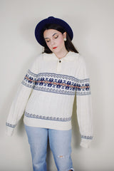 vintage 1980's Jantzen, Made in USA label long sleeve white cable knit pullover sweater with a collar, one button half closure, and an abstract print across chest