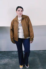 Women's or men's vintage 1980's Sir Jac label long sleeve brown Nylon zip up windbreaker jacket with cotton liner, pockets, and a pointy collar.