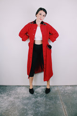 1950's red quilted duster coat with black velvet trim has pointy collar and buttons up the front