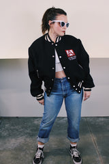 Men's vintage 1970's Empire Sporting Goods, New York, Union Made label long sleeve black wool bomber jacket with white popper buttons and white striped trim. 1979 Jethro Tull in Concert jacket.