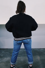 Men's vintage 1970's Empire Sporting Goods, New York, Union Made label long sleeve black wool bomber jacket with white popper buttons and white striped trim. 1979 Jethro Tull in Concert jacket.