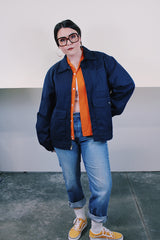 Men's vintage 1980's Topps Safety Apparel Inc., Made in USA label long sleeve navy blue cotton zip up station jacket with three front pockets and collar.