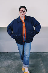 Men's vintage 1980's Topps Safety Apparel Inc., Made in USA label long sleeve navy blue cotton zip up station jacket with three front pockets and collar.