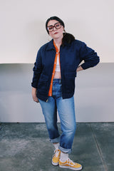 Men's vintage 1980's Topps Safety Apparel Inc., Made in USA label long sleeve navy blue cotton zip up station jacket with three front pockets and collar.