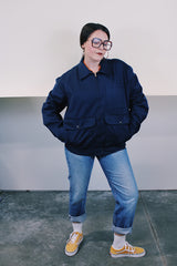 Men's vintage 1980's Topps Safety Apparel Inc., Made in USA label long sleeve navy blue cotton zip up station jacket with three front pockets and collar.