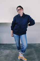 Men's vintage 1980's Topps Safety Apparel Inc., Made in USA label long sleeve navy blue cotton zip up station jacket with three front pockets and collar.