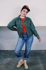 Women's or men's vintage 1990's Dickies label long sleeve green button up lightweight jacket with two chest pockets and collar.