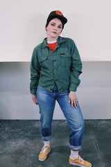 Women's or men's vintage 1990's Dickies label long sleeve green button up lightweight jacket with two chest pockets and collar.