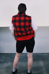 Women's or men's vintage 1980's Ozark Trail label sleeveless zip up black and red buffalo plaid vest with side pockets in cotton material.
