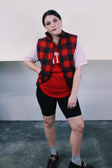 Women's or men's vintage 1980's Ozark Trail label sleeveless zip up black and red buffalo plaid vest with side pockets in cotton material.