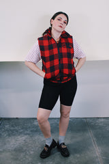 Women's or men's vintage 1980's Ozark Trail label sleeveless zip up black and red buffalo plaid vest with side pockets in cotton material.