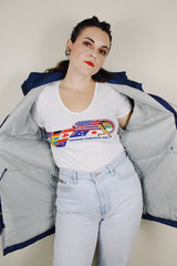 vintage 1980's Woolrich, Made in USA label long sleeve dark blue zip up parka jacket with removable hood, four front velcro pockets, and brass popper buttons