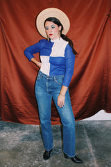 long sleeve color block cream and blue mock neck top with bronze studs vintage women's 1960's