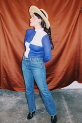 long sleeve color block cream and blue mock neck top with bronze studs vintage women's 1960's