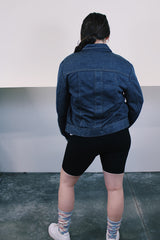 Women's or men's vintage 1980's Ozark Trail label sleeveless zip up black and red buffalo plaid vest with side pockets in cotton material.