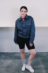 Women's or men's vintage 1980's Ozark Trail label sleeveless zip up black and red buffalo plaid vest with side pockets in cotton material.