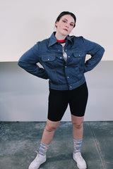 Women's or men's vintage 1980's Ozark Trail label sleeveless zip up black and red buffalo plaid vest with side pockets in cotton material.