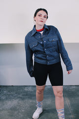 Women's or men's vintage 1980's Ozark Trail label sleeveless zip up black and red buffalo plaid vest with side pockets in cotton material.