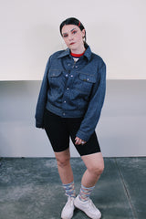 Women's or men's vintage 1980's Ozark Trail label sleeveless zip up black and red buffalo plaid vest with side pockets in cotton material.