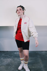 Men's or women's vintage 1970's Swingster, Made in USA label long sleeve cream colored zip bomber jacket. Lightweight polyester and cotton material. Red striped and trim, red Coca Cola embroidery.