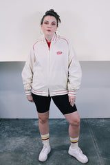 Men's or women's vintage 1970's Swingster, Made in USA label long sleeve cream colored zip bomber jacket. Lightweight polyester and cotton material. Red striped and trim, red Coca Cola embroidery.