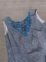 silver metallic tinsel sleeveless long top and shorts with blue beaded detail around chest and hem of shorts, costume vintage 1980's saks ally