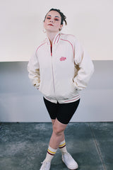 Men's or women's vintage 1970's Swingster, Made in USA label long sleeve cream colored zip bomber jacket. Lightweight polyester and cotton material. Red striped and trim, red Coca Cola embroidery.