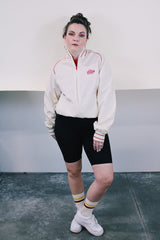 Men's or women's vintage 1970's Swingster, Made in USA label long sleeve cream colored zip bomber jacket. Lightweight polyester and cotton material. Red striped and trim, red Coca Cola embroidery.