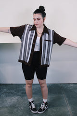 Women's or men's vintage 1970's Da Vinci California label short sleeve button up shirt in brown and white polyester material with striped pattern on the front. Dagger collar.