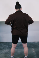 Women's or men's vintage 1970's Da Vinci California label short sleeve button up shirt in brown and white polyester material with striped pattern on the front. Dagger collar.