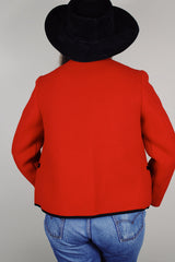 Women's vintage 1970's Boos Austrian Style label, made in Austria long sleeve button up wool jacket in bright red with black trim