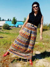 vintage slinky polyester sleeves dress with button up top in black and printed bottom skirt with matching belt front