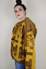 vintage 1980's Amano label, hand knit in Equador, XL 100% wool long sleeve pullover sweater in light brown with an all over yellow print