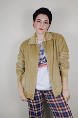 vintage 1980's long sleeve beige brown corduroy jacket with bronze zipper up the front, a pointy collar and side pockets