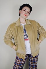 vintage 1980's long sleeve beige brown corduroy jacket with bronze zipper up the front, a pointy collar and side pockets