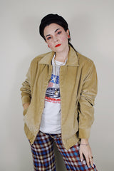vintage 1980's long sleeve beige brown corduroy jacket with bronze zipper up the front, a pointy collar and side pockets