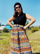 vintage slinky polyester sleeves dress with button up top in black and printed bottom skirt with matching belt front