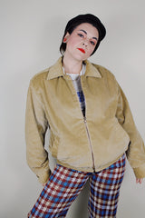 vintage 1980's long sleeve beige brown corduroy jacket with bronze zipper up the front, a pointy collar and side pockets