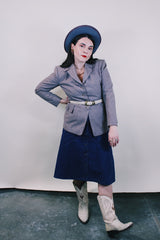 Women's vintage 1950's Jack Frost Woolen Wear, The Original Utah Woolen Mills, Salt Lake City label long sleeve grey colored button up blazer with double lapel, two pockets, and fabric covered buttons.