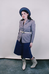 Women's vintage 1950's Jack Frost Woolen Wear, The Original Utah Woolen Mills, Salt Lake City label long sleeve grey colored button up blazer with double lapel, two pockets, and fabric covered buttons.
