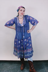 Women's western style vintage 1970's 3/4 arm length midi length boho dress in purple with all over abstract print in sheer lightweight cotton material.