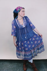 Women's western style vintage 1970's 3/4 arm length midi length boho dress in purple with all over abstract print in sheer lightweight cotton material.