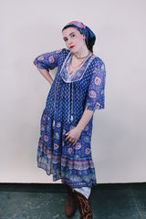 Women's western style vintage 1970's 3/4 arm length midi length boho dress in purple with all over abstract print in sheer lightweight cotton material.