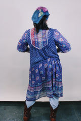 Women's western style vintage 1970's 3/4 arm length midi length boho dress in purple with all over abstract print in sheer lightweight cotton material.