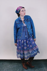 Women's vintage 1990's Wrangler, Made in USA label medium wash denim jacket with brass buttons, two chest pockets, two side pockets and popper button on the cuff.