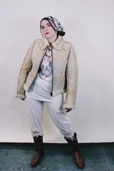 Women's or men's western style vintage 1970's Knight Tailors LTD label long sleeve short length cream colored suede jacket with shearling liner and trim.