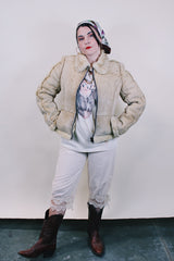 Women's or men's western style vintage 1970's Knight Tailors LTD label long sleeve short length cream colored suede jacket with shearling liner and trim.